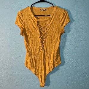 Yellow crisscross front body suit